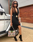 Bonang Matheba shows off one of the three Gucci bags in her enviable wardrobe.