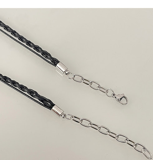 Title 4, Black woven heart necklace featuring bow stitch...