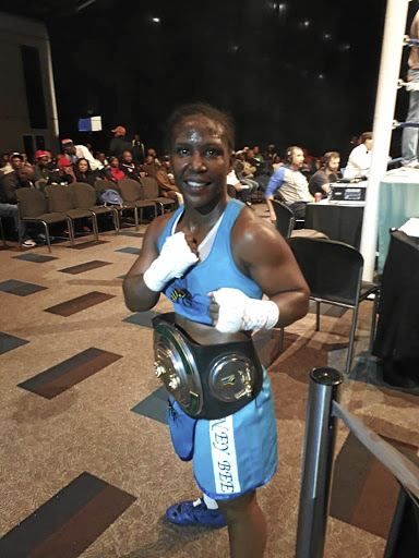 Melissa Miller with her championship belt.