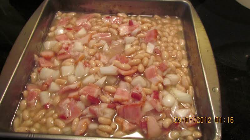 To The Reserved Liquid From The Beans I Added The 1 Cup Sugar, 3/4 Of A Medium Onion, 1/2 Lb Bacon, 1/2 Tsp Pepper And 1 Tablespoon White Vinegar. Mixed Well And Poured Over The Beans. Now They Are Ready For The Oven. 9/07/12