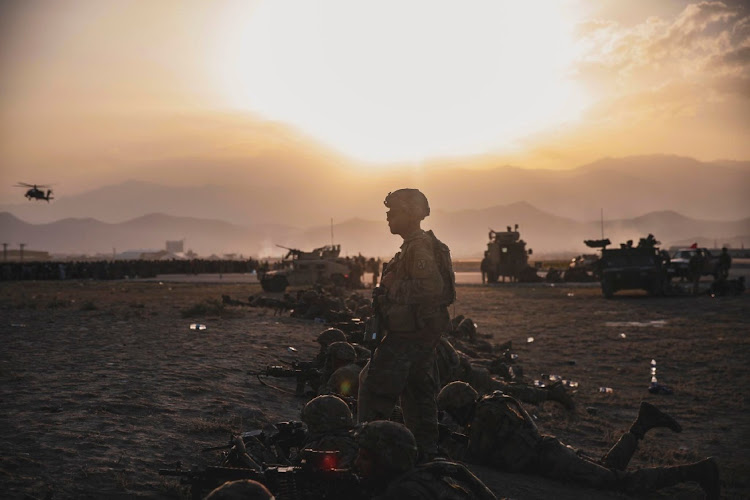 US soldiers stand security at Hamid Karzai International Airport, Kabul, Afghanistan, August 15 2021, amid a withdrawal of American and Nato troops that lead to the Taliban's return to power. Picture: US MARINE CORP/REUTERS