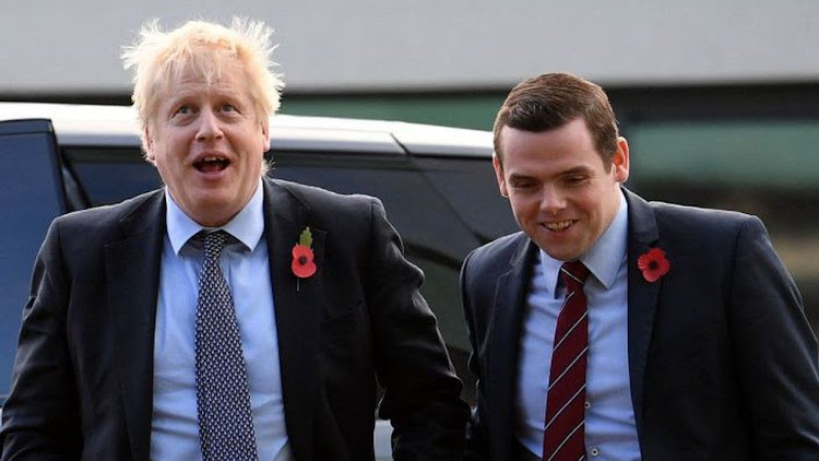 Ross, pictured with Mr Johnson in 2019, said the PM's position was no longer tenable.