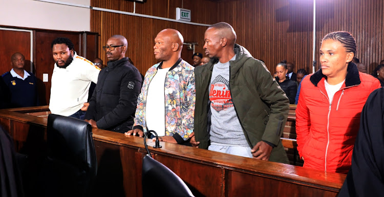 From left, Senohe Matsoara, Teboho Lipholo, Buti Masemola, Tieho Frans Makgotsa and Nastassja Jansen in the Bloemfontein magistrate's court, where they are applying for bail on May 12 2023 after being arrested for allegedly helping Facebook rapist Thabo Bester escape from prison in Mangaung.