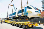 LONG JOURNEY: The first coaches  of Gautrain are on their way to Midrand, Gauteng, from Durban. 03/12/08. © Unknown.