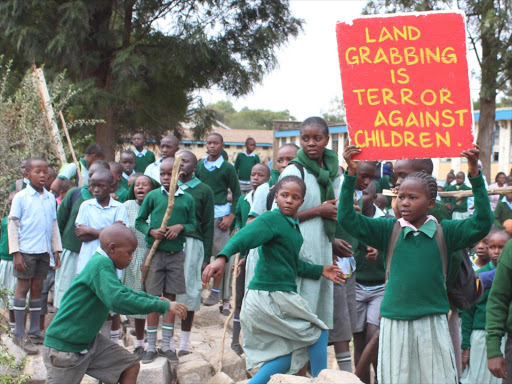 Lang’ata Road Primary School pupils protest on January 19, 2015 against the fencing off of their playground by a hotel associated with Deputy President William Ruto. /FILE