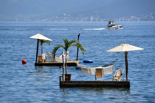 Swim-out rafts in Puerto Vallarta.jpg - At La Playa (beach) in Las Caletas near Puerto Vallarta. Swim out to the raft and rest on a gently wafting hammock.