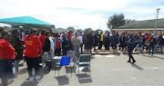 Shop steward Lwando Mange addresses striking nurses in Motherwell during a strike at the Motherwell Community Health Centre.