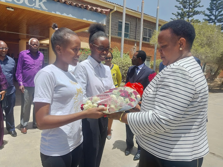 Labour and Skills Development CS Florence Bore is issued with a banquet of flowers by NITA students as a Valentine gift during her familiarization tour of the Authority in Athi River, Machakos County on Tuesday, February 14, 2023.