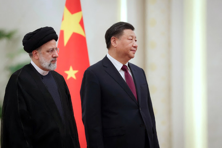 Iranian President Ebrahim Raisi stands next to Chinese President Xi Jinping during a welcoming ceremony in Beijing, China, February 14 2023. Picture: WANA NEWS AGENCY/REUTERS