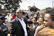 FIRM HAND: Safety and Security Minister Nathi Mthethwa visits Bambayi where two officers were killed. 13/04/09. Pic. Mhlaba Memela. © Sowetan.