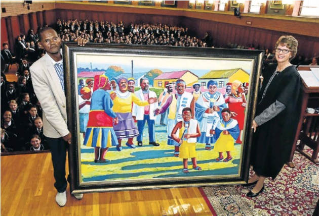 Artist Lizo Pemba and Collegiate High principal Melita Bagshaw hold the painting in the school hall