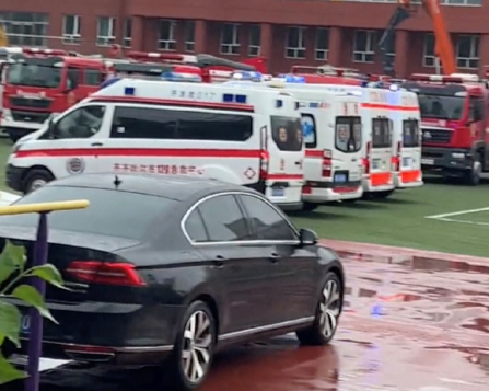 A view of emergency services vehicles near the site where the roof a school gymnasium collapsed, in Qiqihar, Heilongjiang province, China, in this screengrab obtained from a social media video that was released on July 23, 2023.