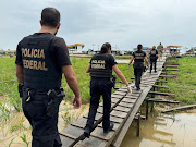 Federal Police officers conduct a raid in a port during the Turquesa Operation, in Benjamin Constant Brazil November 30, 2023. 