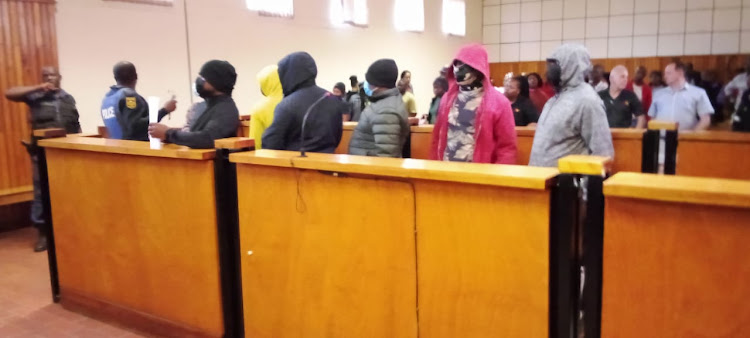 Three police officers appeared in court on Wednesday in connection with a cash-in-transit heist in which R8,000 in coins was stolen.