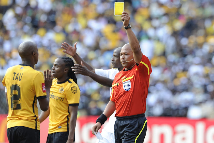 Jimmy Tau and Jerome Damon during the Absa Premiership match between Orlando Pirates and Kaizer Chiefs from FNB Stadium on February 26, 2011 in Soweto, South Africa.