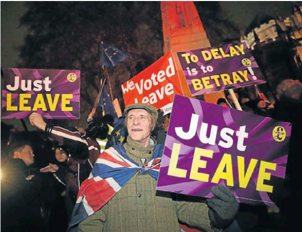 Pro-Brexit demonstrators protest outside the Houses of Parliament, in Westminster on Tuesday night