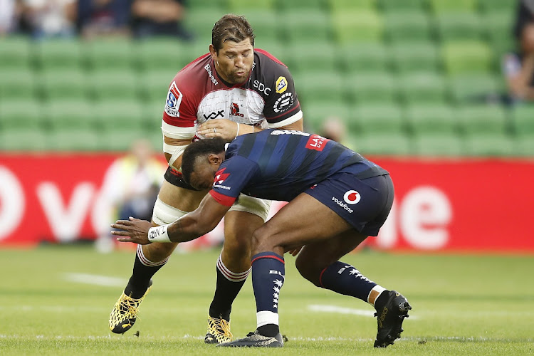 Willem Alberts of the Lions is tackled by Marika Koroibete of the Rebels during the days of Super Rugby.