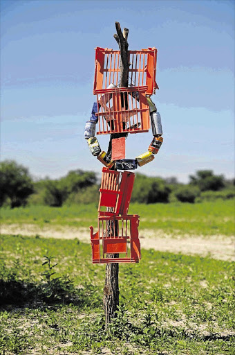 CAN BE FOUND: An elaborate sign marks the entrance to a homestead