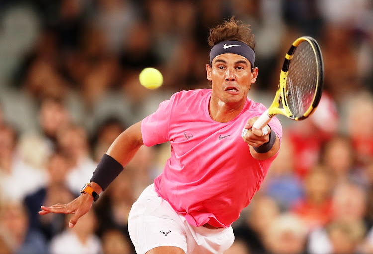 Rafael Nadal stretches for the ball during his Match in Africa against Roger Federer at Cape Town Stadium on February 7 2020.