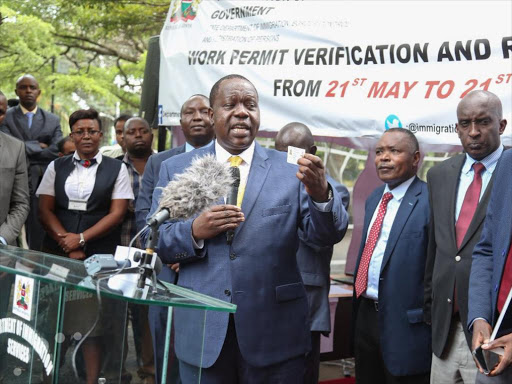 Interior CS Fred Matiang'i during the work permit verification and registration exercise at Nyayo House, May 21, 2018. /COURTESY