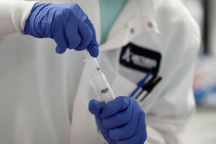 A scientist conducts research on a vaccine for the novel coronavirus at the laboratories of RNA medicines company Arcturus Therapeutics in San Diego, California, U.S., March 17, 2020. REUTERS/Bing Guan/File Photo