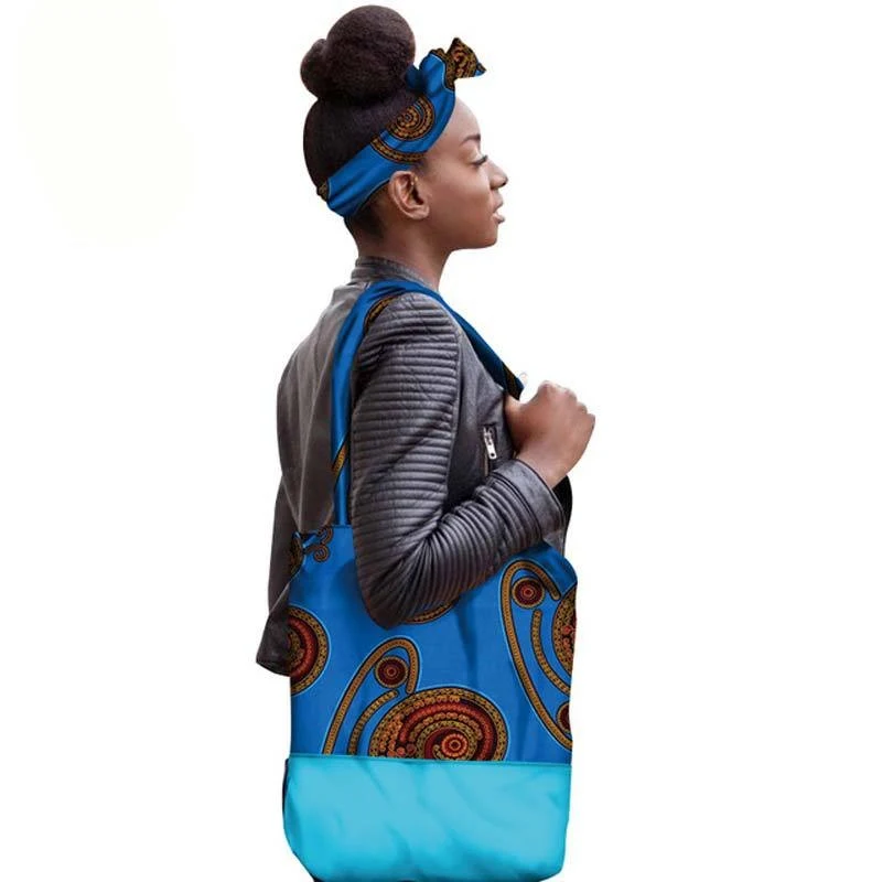 Afrikaanse schoudertas van 100% katoen met wax print. Draag je benodigdheden met stijl en comfort. Een uniek en levendig accessoire voor elke dag!