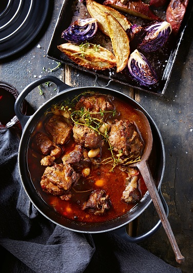 Braised oxtail with red wine and butter beans.