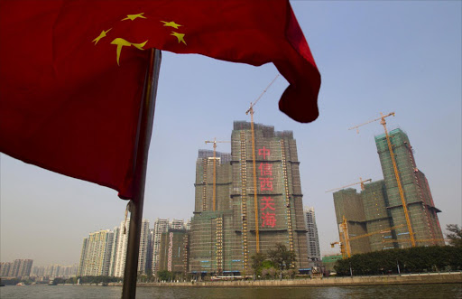 A Chinese national flag flutters on the Pearl River in Guangzhou, Guangdong province, China. Picture: REUTERS