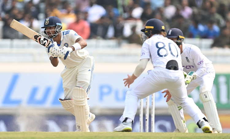 India batsmen Dhruv Jurel picks up runs past close in-fielder Ollie Pope as Ben Foakes looks on on day four of the fourth Test at JSCA International Stadium Complex in Ranchi, India on Monday.