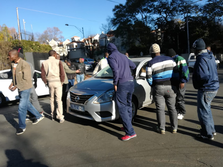 Uber and Taxify operators stop some of the operators near Zoo Lake in Johannesburg.