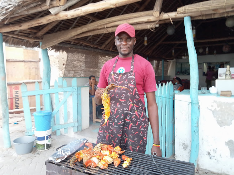 Chef David Tuva barbecues lobster on the streets of Lamu island