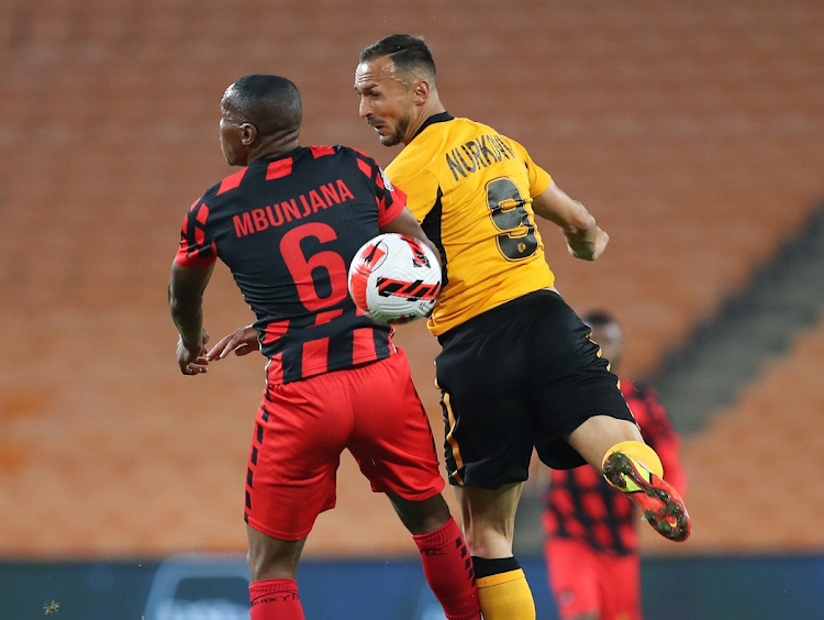 Samir Nurkovic of Kaizer Chiefs wins a header against Mlungisi Mbunjana of TS Galaxy in the DStv Premiership match at FNB Stadium on April 5 2022.