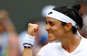 Tunisia's Ons Jabeur reacts during her Wimbledon quarterfinal against Kazakhstan's Elena Rybakina 
at the All England Lawn Tennis and Croquet Club on July 12 2023.