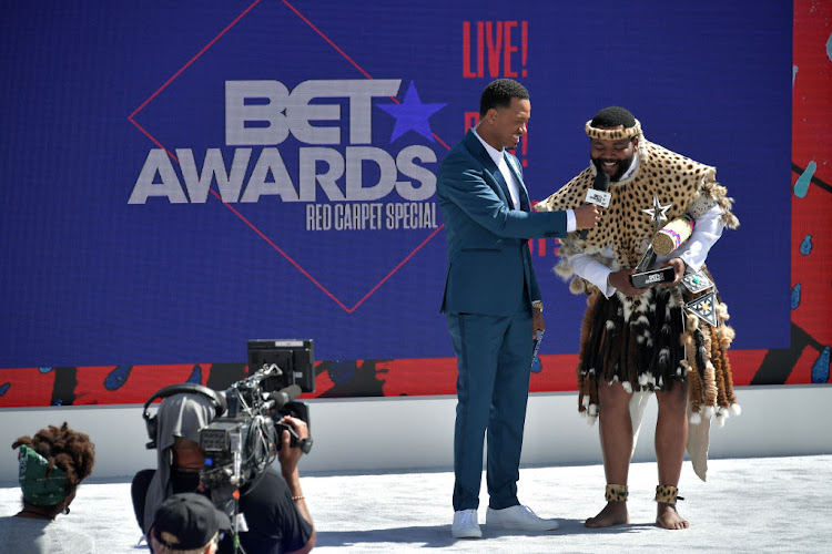 Host Terrence J (left) presents Sjava with the Viewers' Choice: Best International Act Award at the 2018 BET Awards on June 24 2018 in Los Angeles.