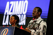 Kenya's opposition leader and presidential candidate Raila Odinga, of the Azimio La Umoja (Declaration of Unity) One Kenya Alliance, speaks alongside his running-mate Martha Karua during a news conference on the day he filed a petition challenging the presidential election result, in Nairobi, Kenya August 22, 2022.