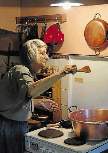 Maggie Pepler at her 'easel', the stove