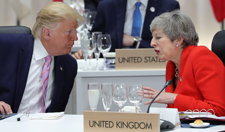 Britain's Prime Minister Theresa May speaks with U.S. President Donald Trump during the G20 summit in Osaka, Japan June 28, 2019.