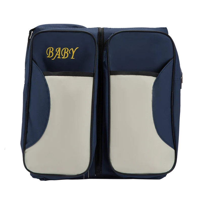 Lit de voyage pliable portable et sac à langer pour maman et bébé. Voyagez léger, dormez en sécurité et emportez l'essentiel.