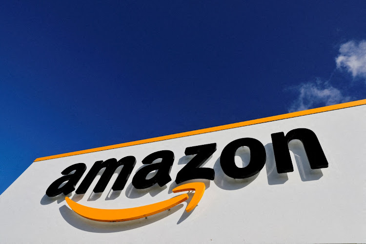 FILE PHOTO: The logo of Amazon is seen at the company's logistics centre in Boves, France, October 6, 2021 REUTERS/PASCAL ROSSIGNOL