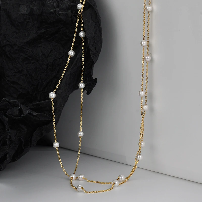 Collier artisanal en argent sterling S925 avec perles de coquillage, chaîne de pull à deux perles, un bijou intemporel et élégant pour femmes.