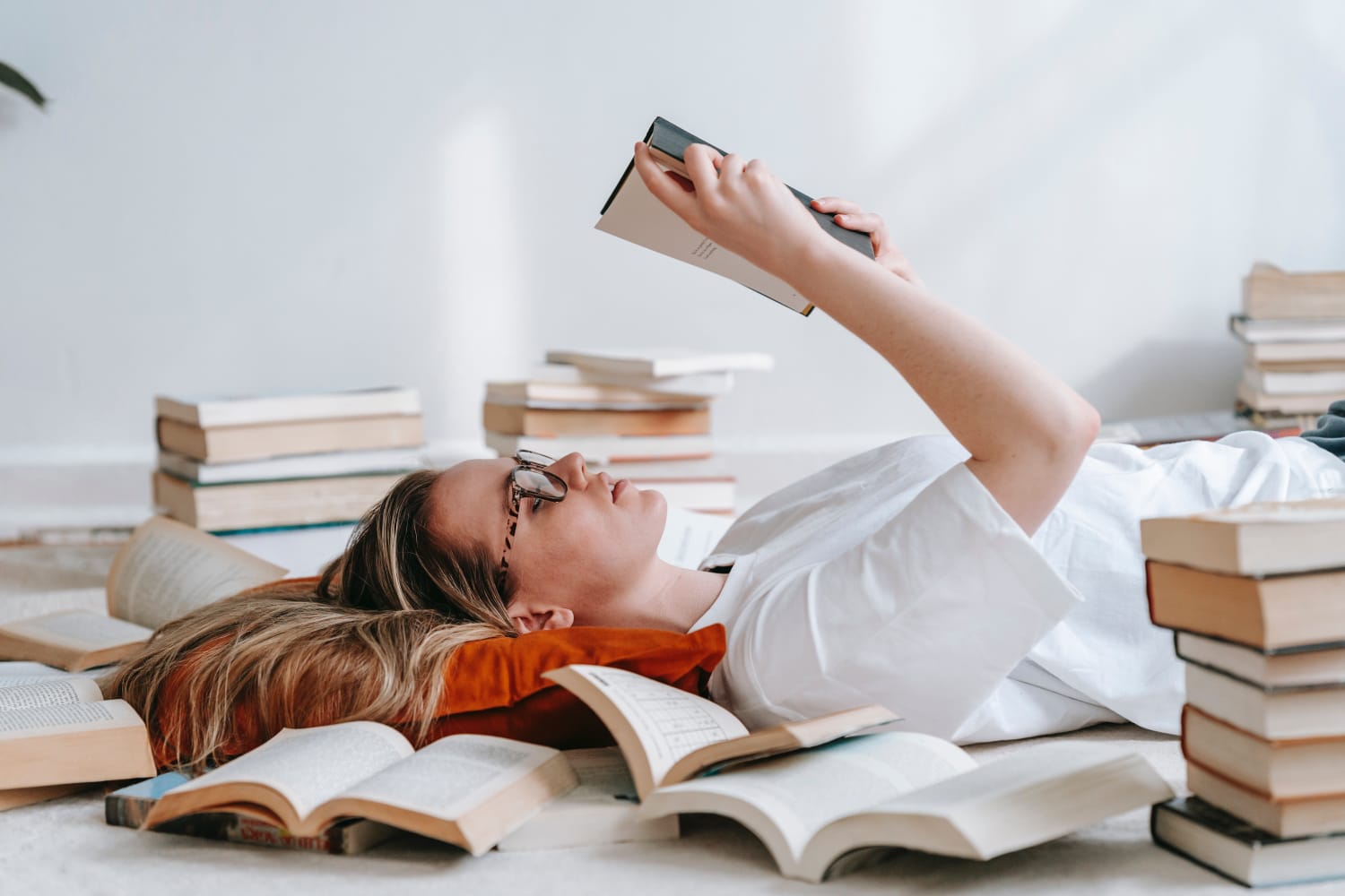 A woman reading a book. 