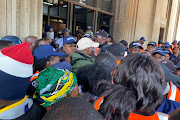 Students tried to force their way into the Wits Great Hall, but were held back by security guards.