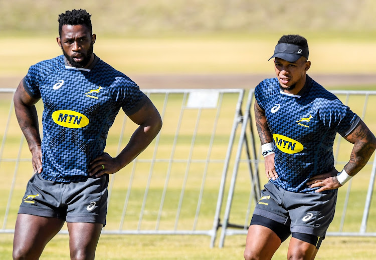 Siya Kolisi, left, and Elton Jantjies during the Springbok team captains run at St Stithians on Thursday in Johannesburg