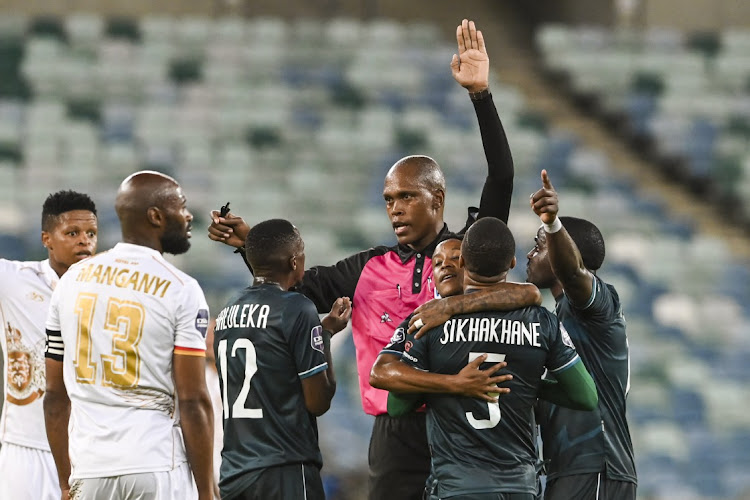 Referee Luxolo Badi and players during the DStv Premiership match between AmaZulu FC and Royal AM at Moses Mabhida Stadium on February 25, 2023 in Durban.