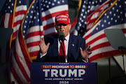 Republican presidential candidate and former US President Donald Trump speaks during a campaign event in Freeland, Michigan, US May 1, 2024. 