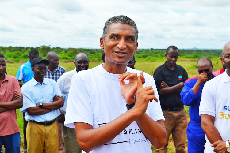 Strathmore University VC Vincent Ogutu speaking at Seku campus in Kitui during the tree planting exercise on Friday