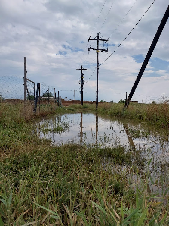 Residents have to walk through water when roads are flooded.