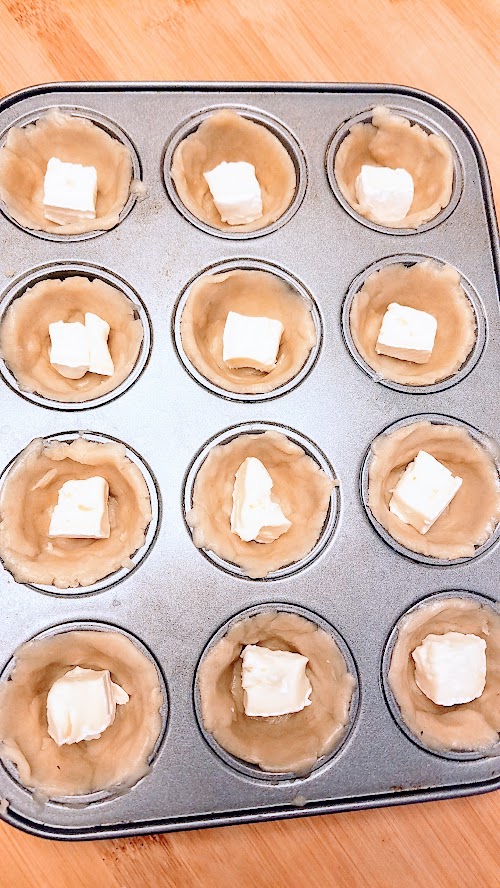 Berry Brie Bites, an easy recipe using only 4 ingredients Cut the brie into squares that can fill each mini-muffin spot that the pie dough already pressed in.