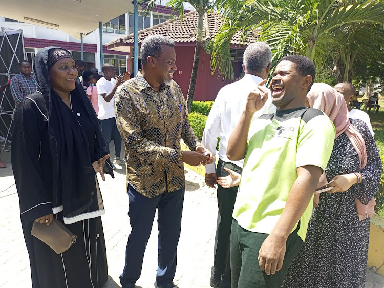 DPP Noordin Haji [C] and Haki Africa executive director Hussein Khalid at the Kenya Methodist University in Mombasa on Thursday.