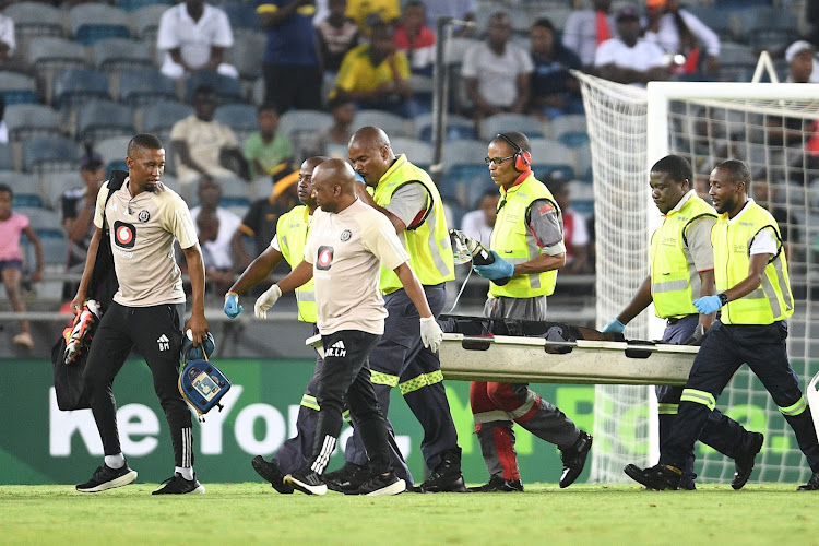 Orlando Pirates midfielder Makhehlene Makhaula is stretched off field after collapsing in the Nedbank Cup last 16 against Hungry Lions at Orlando Stadium. Picture: GALLO IMAGES/LEFTY SHIVAMBU